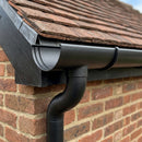 Half Round Aluminium Gutter Outlet 63mm Dia. 125mm — Textured Black (in use)