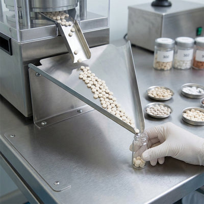 Triangular stainless steel tablet counter with etched legend