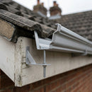 Moulded Ogee Gutter Rise and Fall Bracket 125 x 100mm — RAL 9006 (in use)