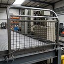 Mesh pedestrian safety railing with debris deflection panel