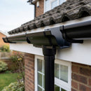 Moulded Ogee Gutter Outlet 63mm Dia, 125 x 100mm — RAL 9005 (in use)