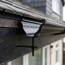 Moulded Ogee Gutter Rise and Fall Bracket 125 x 100mm — RAL 9005 (in use)
