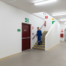 Gray Premium Running Man Down Left Arrow Fire Safety Sign