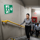 Dim Gray Premium Fire Safety Signs - Running Man Downwards Arrow