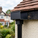 Aluminium Box Gutter Outlet 72×72mm to 135×100mm — Textured Black (in use)