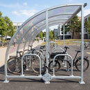 Curved bike shelter with perspex roof and steel frame